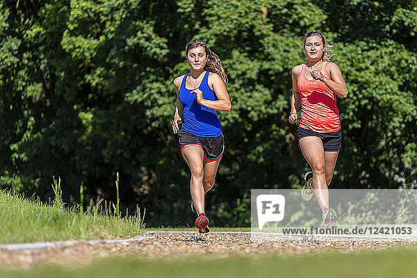 Female joggers on woodchip trail