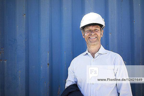 Portrait of smiling man wearing shirt and hard hat