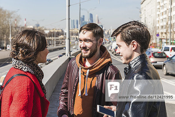 Russia  Moscow  group of friends talking next to a road