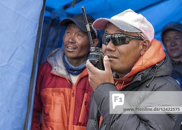 Nepal  Solo Khumbu  Everest  Sagamartha National Park  Man talking on a walkie talkie