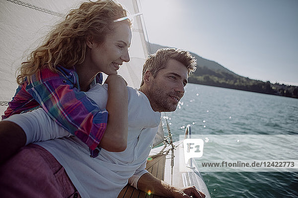Happy couple on a sailing boat