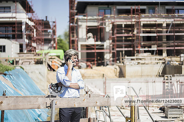 Man on cell phone on construction site