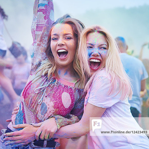 Friends dancing together at music festival