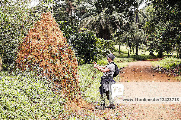 Uganda  Entebbe Botanic Gardens  Tourist taking pictures of