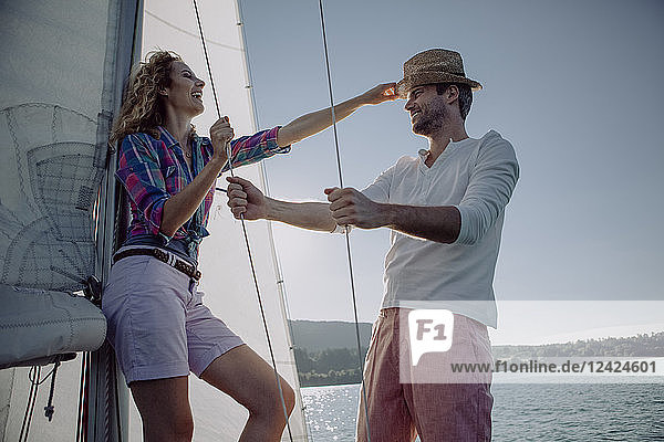 Happy couple on a sailing boat