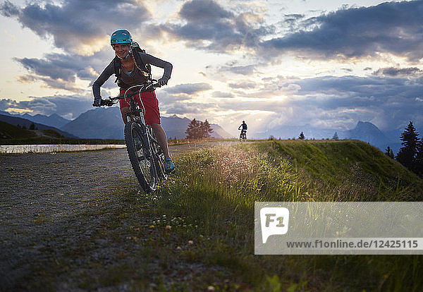 Austria,  Tyrol,  male and female downhill mountain biker