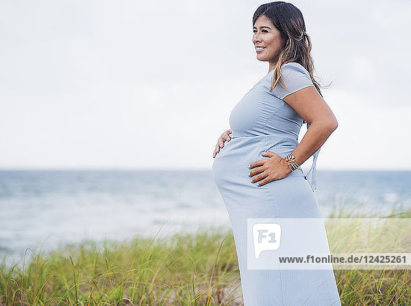 Pregnant woman wearing blue dress