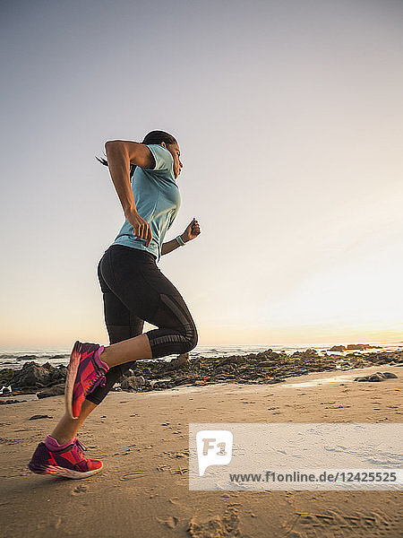 USA  California  Newport Beach  Woman jogging on beach