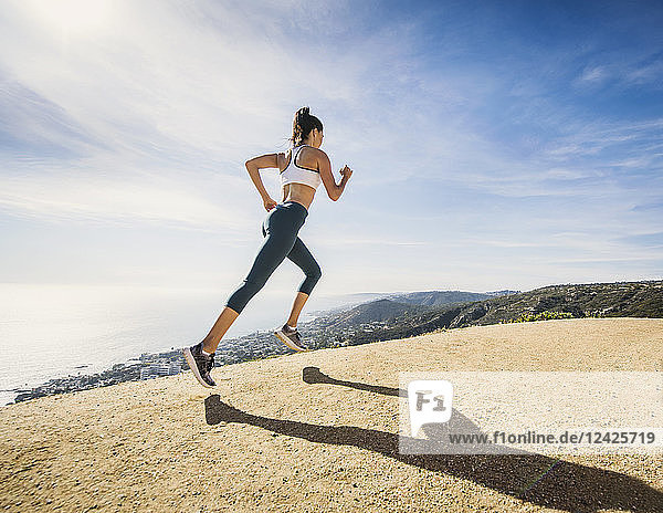 Woman jogging on mountain