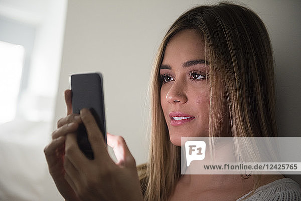 Young woman using smart phone