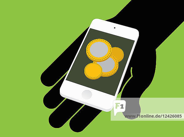 Hand holding smart phone with coins on screen