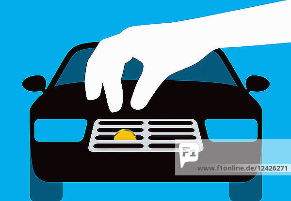 Hand inserting coin into car radiator grille