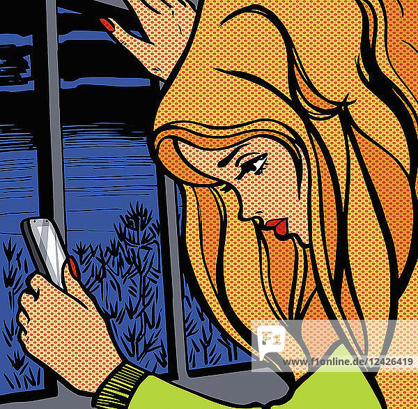Junge Frau überprüft nachts ihr Smartphone am Fenster