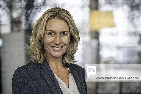 Close-up of cheerful businesswoman