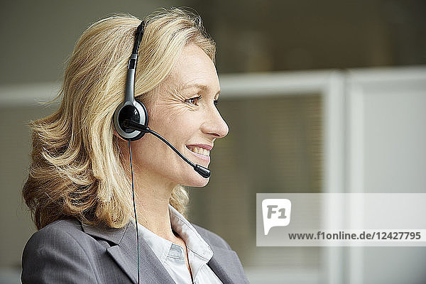 Close-up of telecaller with headset