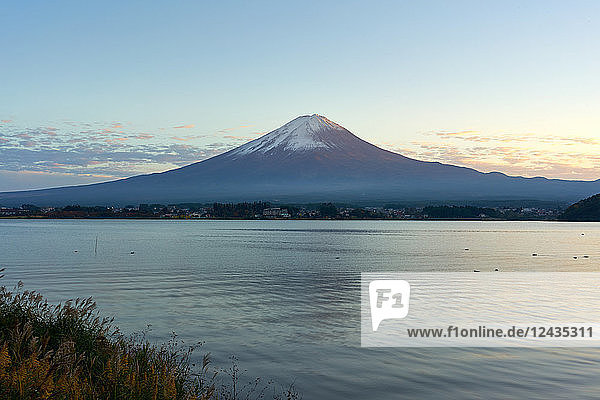 Mount Fuji  UNESCO World Heritage Site  and Lake Kawaguchiko at twilight  Yamanashi Prefecture  Honshu  Japan  Asia