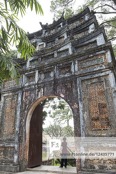 An ornately decorated gate in the grounds of the Tu Duc Tomb near Hue Vietnam Indochina Southeast Asia Asia