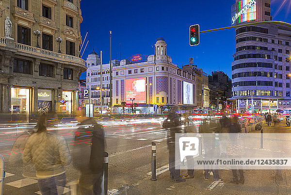 View of architecture and trail lights on Gran Via and Plaza del Calao at dusk  Madrid  Spain  Europe