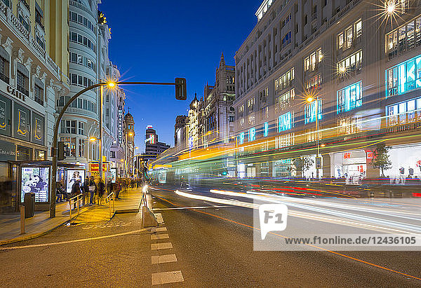View of architecture and trail lights on Gran Via at dusk  Madrid  Spain  Europe