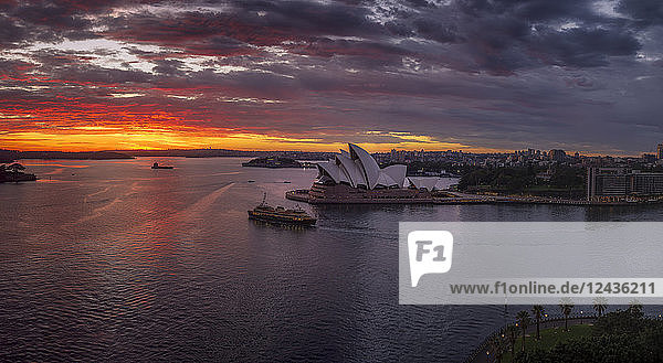 Dramatic sunrise at the Sydney Harbour  with a view of the Sydney Opera House  UNESCO World Heritage Site  Sydney  New South Wales  Australia  Pacific