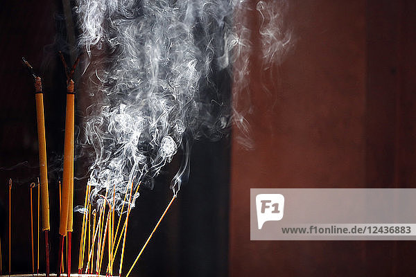 Burning incense sticks  Taoist temple  Emperor Jade Pagoda (Chua Phuoc Hai)  Ho Chi Minh City  Vietnam  Indochina  Southeast Asia  Asia