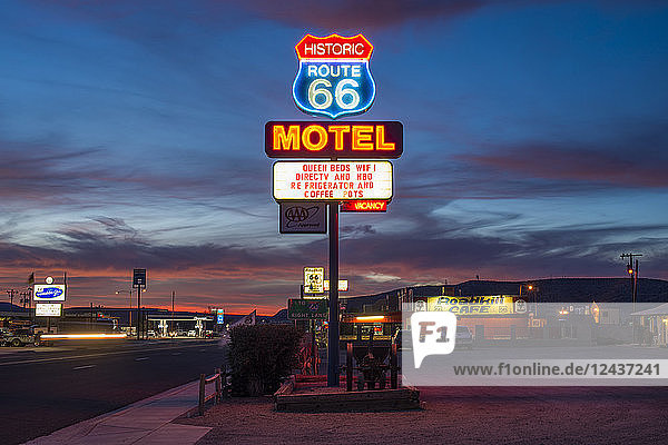 Historic Route 66 neon sign glowing at sunset Seligman Arizona United States of America North America