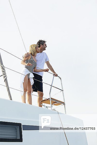 Mature couple making holidays  sailing on a catamaran