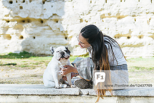 Woman talking to her dog outside