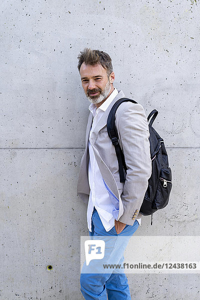 Portrait of casual businessman with backpack