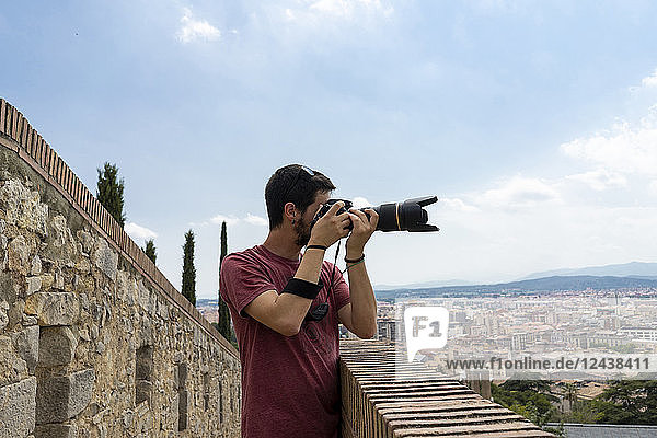 Spain  Girona  man at the castletaking picture of the city