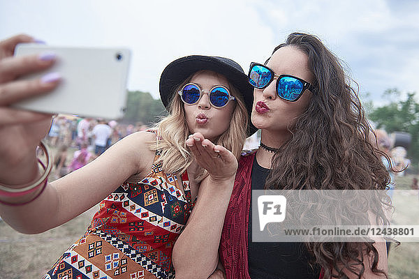 Young people making selfie at music festival