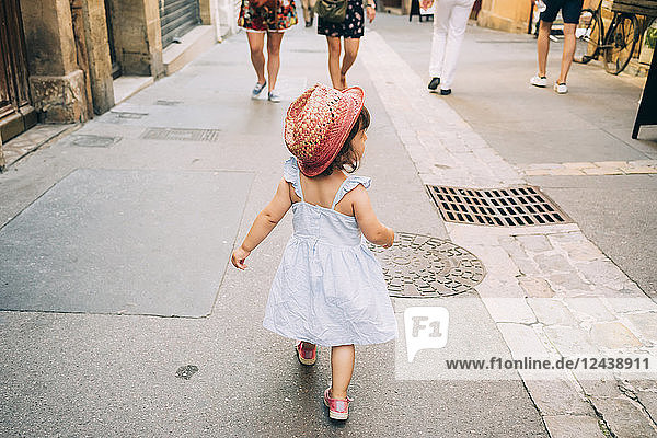 France  Aix-en-Provence  toddler girl walking down the streets of the city center