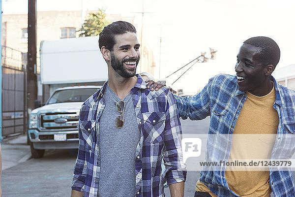 Two happy young men outdoors