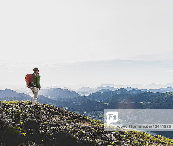 Austria  Salzkammergut  Hiker with backpack hiking in the Alps