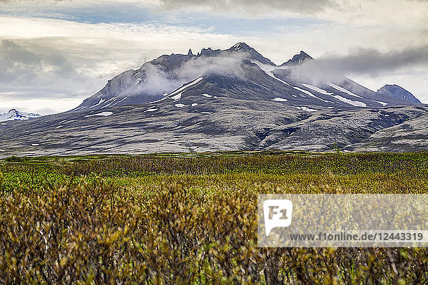 A wide angle view hiking the plateau trails towards the dormant volcano at Vatnajokull National Park  Iceland