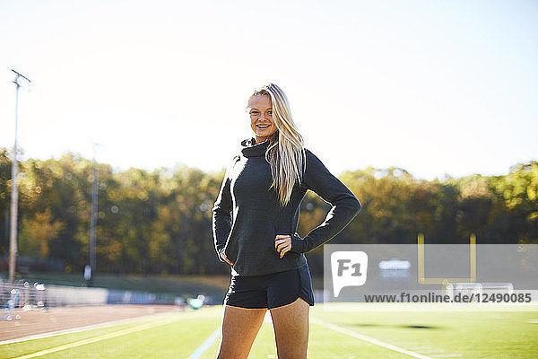 Portrait Of A Female Athlete Standing On The Ground