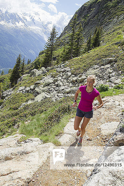 Girl Running Uphill In The Chamonix Valley