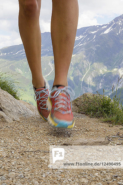 Athlete girl trail running in Chamonix