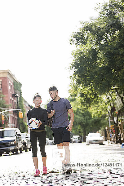 Couple Walking Home After Workout