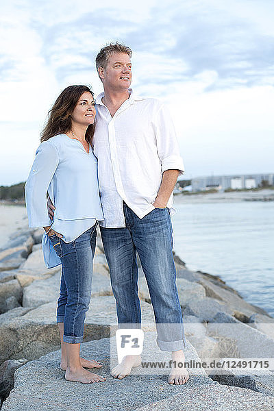 A couple are photographed at a Cape Cod beach.