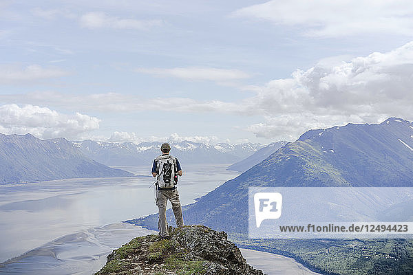 Make hiker at Hope Point in Chugach National Forest Alaska overlooking Turnagain Arm