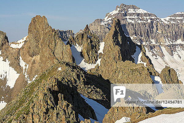 Distant View Of A Woman Hiking On Blaine Peak Below Mount Sneffels