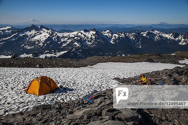 Climbers rest in their tents while ascending Mount Rainier in Mount Rainier National Park  Washington  USA.