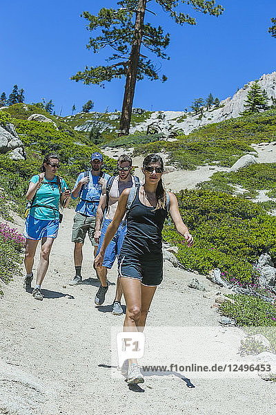 Group of young hikers on the Five Lakes Trail in the Granite Chief Wilderness