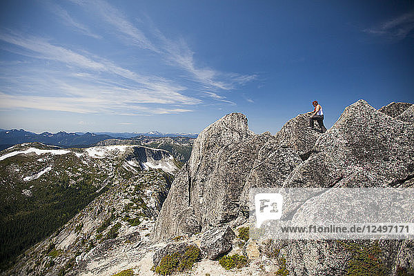 Evan Howard  a climber and explorer  climbs over granite rock in British Columbia  Canada.