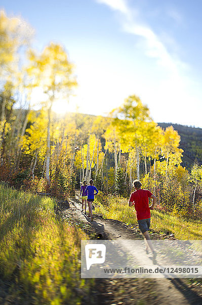 Group of people running on a trail in Park City  Utah
