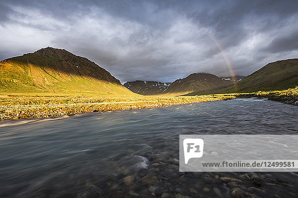 A Rainbow Arcs Over A River In The Landscape At Lake Clark National Park And Preserve  Alaska
