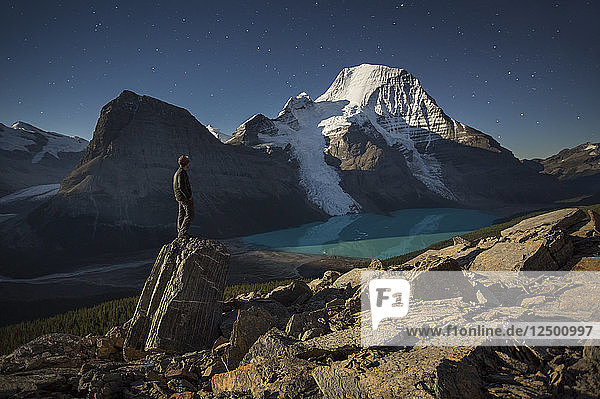 A Man Overlooking Glacial Lake At Mount Robson Provincial Park  Canada