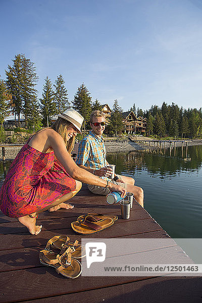Couple Hanging Out On A Dock On Lake Pend Oreille  Sandpoint  Idaho