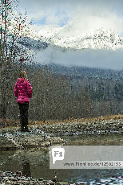 Woman looks out at mountain